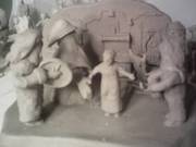 this piece contains five mummers and a figure of Grannie and her rock